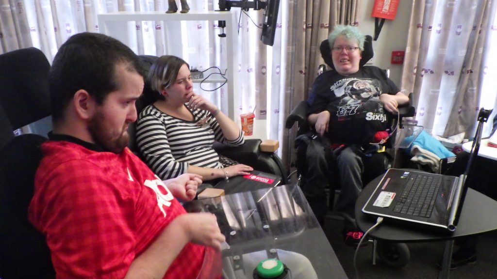 Photograph of group using assistive technology